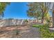 Landscaped backyard featuring mature trees, plants, and a block wall at 8628 Desert Holly Dr, Las Vegas, NV 89134