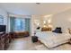 Comfortable bedroom with matching furnishings, wood floors, and plenty of natural light at 8628 Desert Holly Dr, Las Vegas, NV 89134