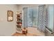 Pantry shelves with plenty of storage space next to refrigerator in a well-lit kitchen area at 8628 Desert Holly Dr, Las Vegas, NV 89134
