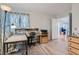 Bright home office with wood-look floors, large window, and functional workspace at 8628 Desert Holly Dr, Las Vegas, NV 89134