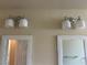 Bathroom wall with framed mirrors and decorative light fixtures at 8641 Surtidor Dr, Las Vegas, NV 89117