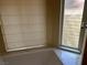 Bathroom featuring a soaking tub with a window and blinds at 8641 Surtidor Dr, Las Vegas, NV 89117