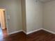 Bedroom with wood-look flooring and open doorway at 8641 Surtidor Dr, Las Vegas, NV 89117