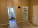 Carpeted bedroom with view to bathroom and walk-in closet featuring neutral color walls and trim at 8641 Surtidor Dr, Las Vegas, NV 89117