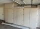 Garage with built-in cabinets at 8641 Surtidor Dr, Las Vegas, NV 89117