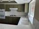 Kitchen featuring olive green cabinets and white countertops at 8641 Surtidor Dr, Las Vegas, NV 89117