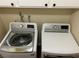 Laundry room features a modern washer and dryer set and white cabinetry for ample storage solutions at 8641 Surtidor Dr, Las Vegas, NV 89117