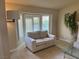 Living room featuring a sofa, fireplace, and bay window with shutter shades at 8641 Surtidor Dr, Las Vegas, NV 89117