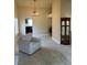 Living room showcasing neutral carpet, chandelier, fireplace and view into the kitchen at 8641 Surtidor Dr, Las Vegas, NV 89117