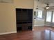 View from the living room features wood floors, custom cabinets and view to kitchen at 8641 Surtidor Dr, Las Vegas, NV 89117