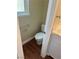Small bathroom with a toilet, vanity, and a glass shelf at 8641 Surtidor Dr, Las Vegas, NV 89117