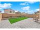 This backyard features a charming patio and a small, manicured lawn area at 9176 Bluebell Knoll Ct, Las Vegas, NV 89178