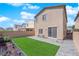 The cozy backyard features a sliding door, a patio, and a strip of well-kept lawn at 9176 Bluebell Knoll Ct, Las Vegas, NV 89178