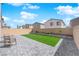 The backyard features a tidy patio and a quaint lawn, perfect for outdoor relaxation at 9176 Bluebell Knoll Ct, Las Vegas, NV 89178