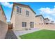 Backyard with a patio and small lawn, offering a cozy outdoor retreat at 9176 Bluebell Knoll Ct, Las Vegas, NV 89178