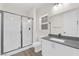 Clean bathroom features a glass shower, vanity with gray counters, and modern fixtures at 9176 Bluebell Knoll Ct, Las Vegas, NV 89178