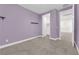 This bedroom features modern paint, an updated light fixture, and plush carpet at 9176 Bluebell Knoll Ct, Las Vegas, NV 89178