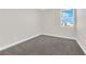 Bright bedroom features neutral paint, plush carpet and a window at 9176 Bluebell Knoll Ct, Las Vegas, NV 89178