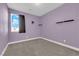 Bedroom features a modern ceiling light, a window, and plush carpet at 9176 Bluebell Knoll Ct, Las Vegas, NV 89178