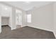 Bedroom showcasing neutral walls, carpet, natural light, and closet space at 9176 Bluebell Knoll Ct, Las Vegas, NV 89178