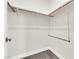 Bright closet with white walls, plush carpet and updated closet fixtures at 9176 Bluebell Knoll Ct, Las Vegas, NV 89178