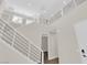 Bright entryway featuring a staircase with modern railings, a neutral color palette, and an open floor plan at 9176 Bluebell Knoll Ct, Las Vegas, NV 89178