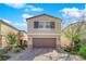 Charming two-story home with a well-manicured lawn and a two-car garage at 9176 Bluebell Knoll Ct, Las Vegas, NV 89178