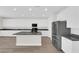 Expansive kitchen featuring an island, stainless steel appliances, and modern lighting at 9176 Bluebell Knoll Ct, Las Vegas, NV 89178