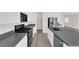 Modern kitchen featuring stainless steel appliances, granite countertops, and sleek white cabinetry at 9176 Bluebell Knoll Ct, Las Vegas, NV 89178
