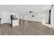 Bright living area boasts hardwood floors, neutral walls and a contemporary ceiling fan at 9176 Bluebell Knoll Ct, Las Vegas, NV 89178
