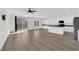 Spacious living room with sleek flooring, lots of natural light and a modern ceiling fan at 9176 Bluebell Knoll Ct, Las Vegas, NV 89178