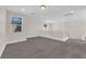 Spacious loft area with neutral carpeting, modern railings, and ample natural light at 9176 Bluebell Knoll Ct, Las Vegas, NV 89178