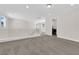 Bright, open loft area with carpeting, modern railings, and a functional layout, perfect for versatile use at 9176 Bluebell Knoll Ct, Las Vegas, NV 89178