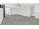 Spacious main bedroom with ensuite bathroom featuring neutral paint and carpet at 9176 Bluebell Knoll Ct, Las Vegas, NV 89178