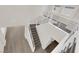 High-angle view of a carpeted staircase with modern railings, connecting levels in a bright, open space at 9176 Bluebell Knoll Ct, Las Vegas, NV 89178