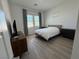 Modern bedroom with hard surface floors, neutral tones, and natural light at 928 Woodburn Ln, Las Vegas, NV 89138