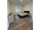 Comfortable bedroom with hard surface floors, natural light, and simple furnishings at 928 Woodburn Ln, Las Vegas, NV 89138