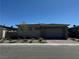 Charming home with a brick driveway and stone accents on the garage at 928 Woodburn Ln, Las Vegas, NV 89138