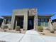 Modern home featuring a stacked stone accent wall and drought resistant landscaping at 928 Woodburn Ln, Las Vegas, NV 89138