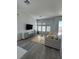 Inviting living room with hardwood floors and plenty of natural light from the windows at 928 Woodburn Ln, Las Vegas, NV 89138
