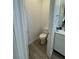 Clean half bathroom with tile flooring and efficient use of space at 928 Woodburn Ln, Las Vegas, NV 89138