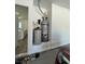 A water heater and filtration system sit in an alcove in the garage at 928 Woodburn Ln, Las Vegas, NV 89138