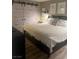Bedroom features a black bed frame and sliding barn doors to the closet at 9325 W Desert Inn Rd # 174, Las Vegas, NV 89117