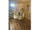 Bright dining area with a glass-top table and four white chairs at 9325 W Desert Inn Rd # 174, Las Vegas, NV 89117