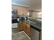Updated kitchen featuring stainless steel appliances and a breakfast bar overlooking the living area at 9325 W Desert Inn Rd # 174, Las Vegas, NV 89117
