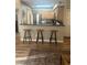 Kitchen with a breakfast bar and three stools at 9325 W Desert Inn Rd # 174, Las Vegas, NV 89117