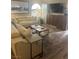 A spacious living room with a large sectional sofa and decorative rug creating a cozy atmosphere at 9325 W Desert Inn Rd # 174, Las Vegas, NV 89117