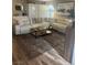 Open concept living room features a large sectional sofa, stylish rug, and modern decor at 9325 W Desert Inn Rd # 174, Las Vegas, NV 89117