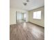 Bedroom with wood floors, a window with blinds and a mirrored closet at , Las Vegas, NV 89103