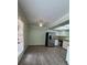 Kitchen area with stainless steel refrigerator and dining area with natural light at , Las Vegas, NV 89103
